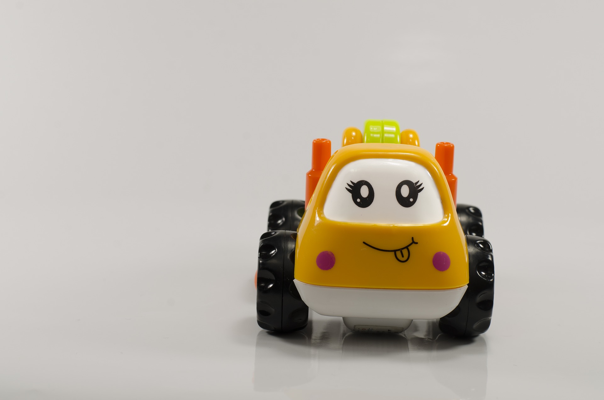 A yellow children's toy car