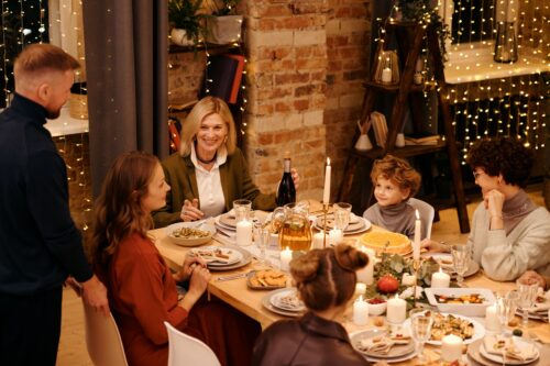 Family eating Holiday dinner at a table